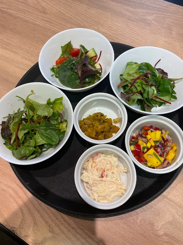 Orlenes Kitchen event catering - elegant platter with fresh salads and condiments for celebrations